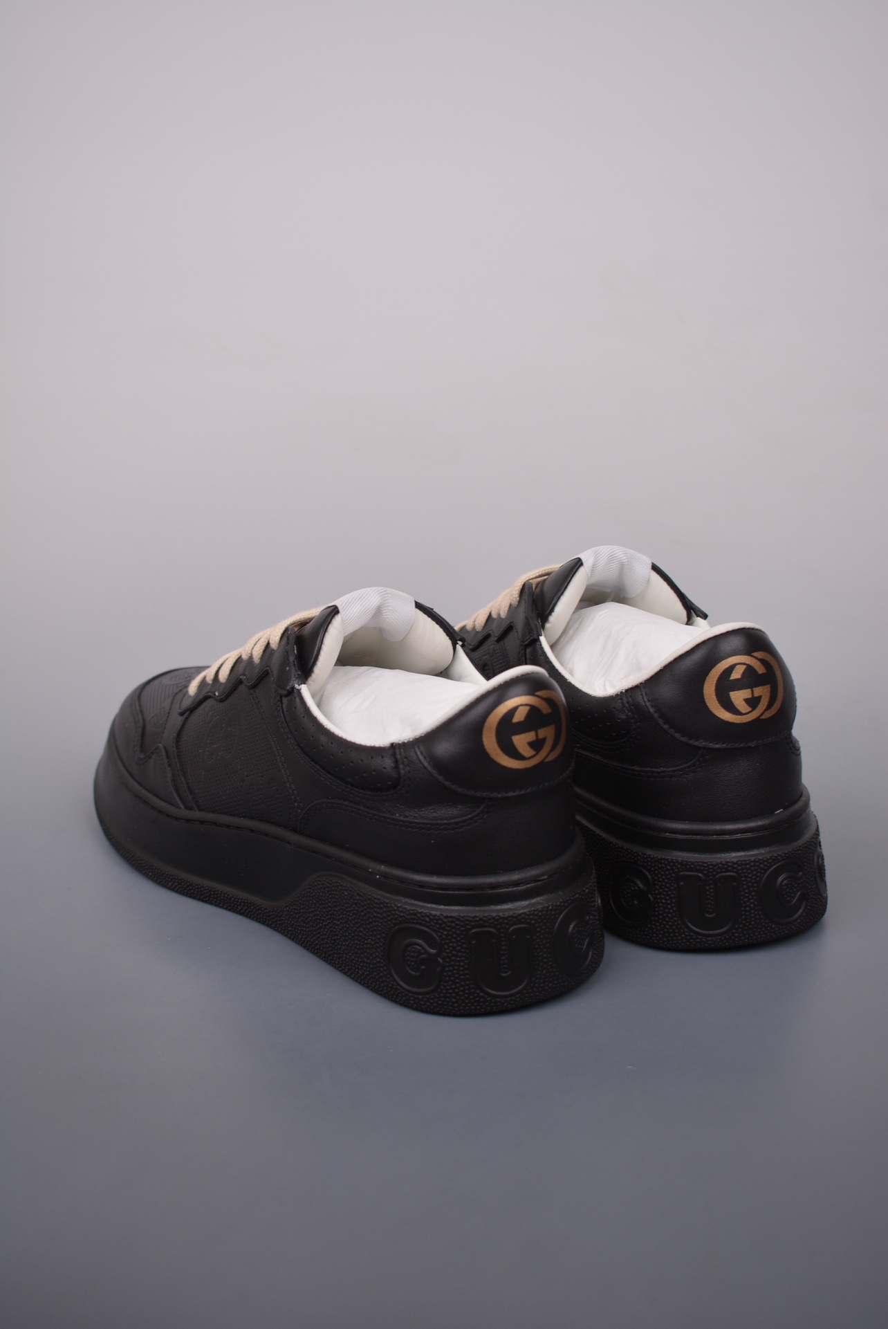 GUCCI punched leather all black gold GG print embossed