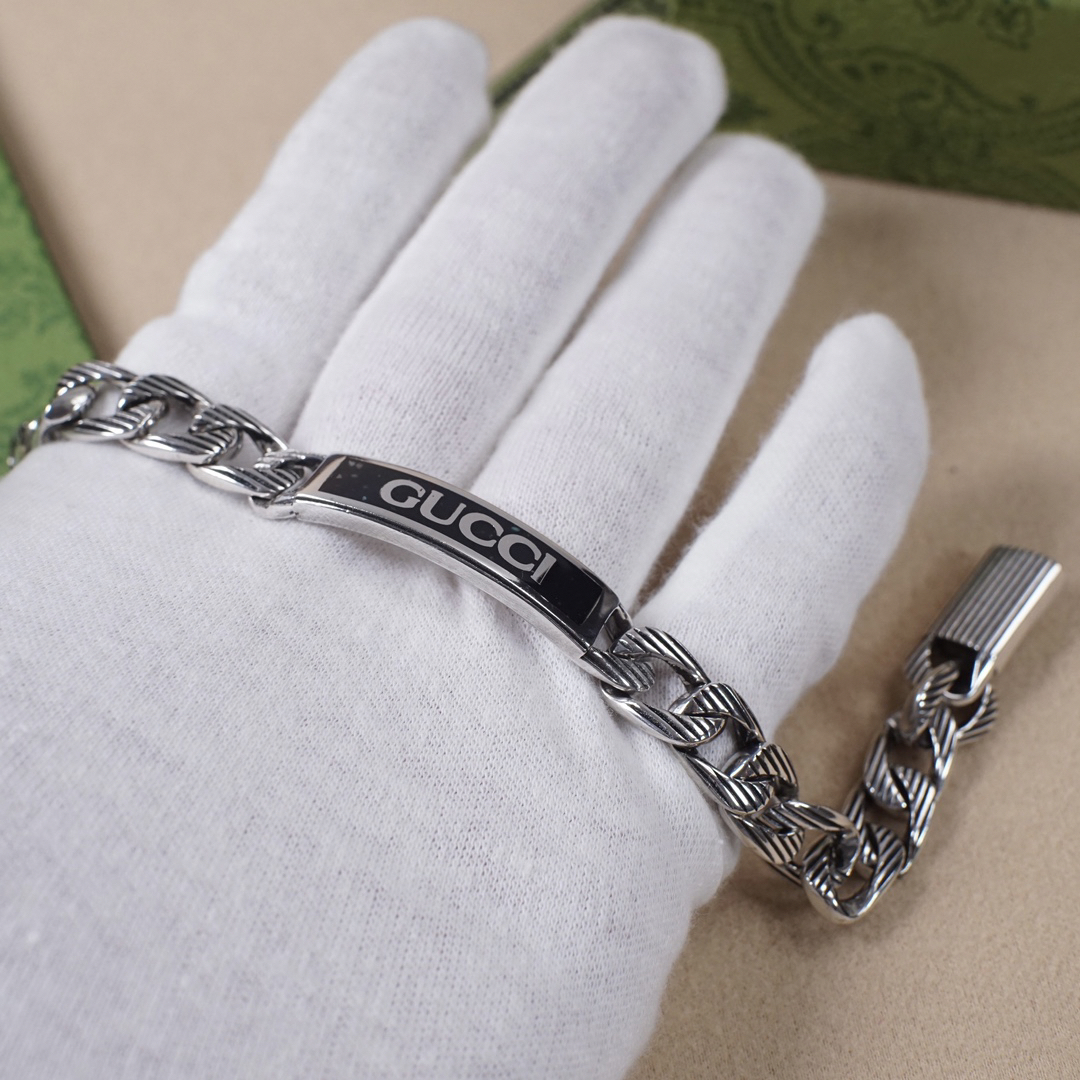 Gucci hand brand distressed bracelet