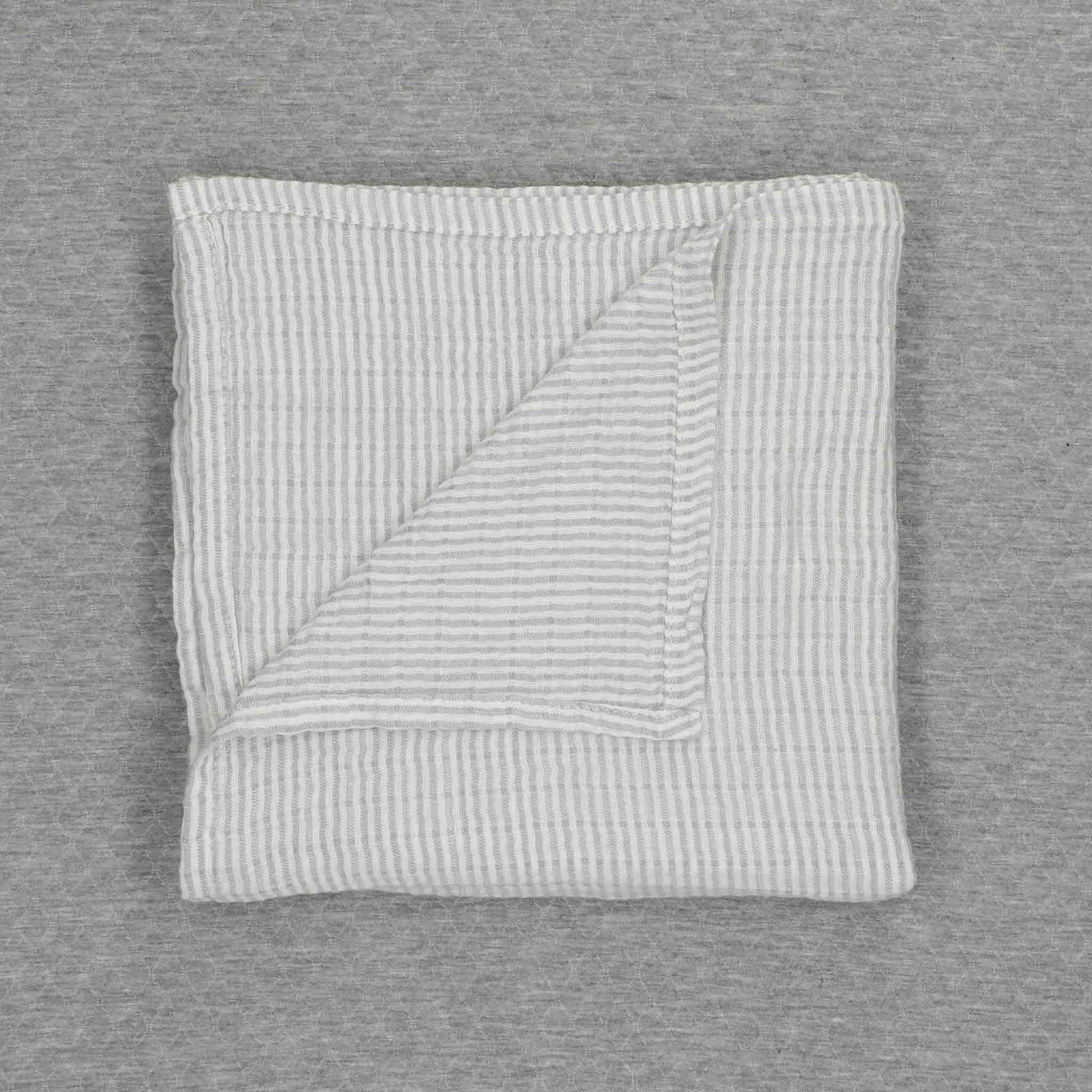Muselina Raya Gris