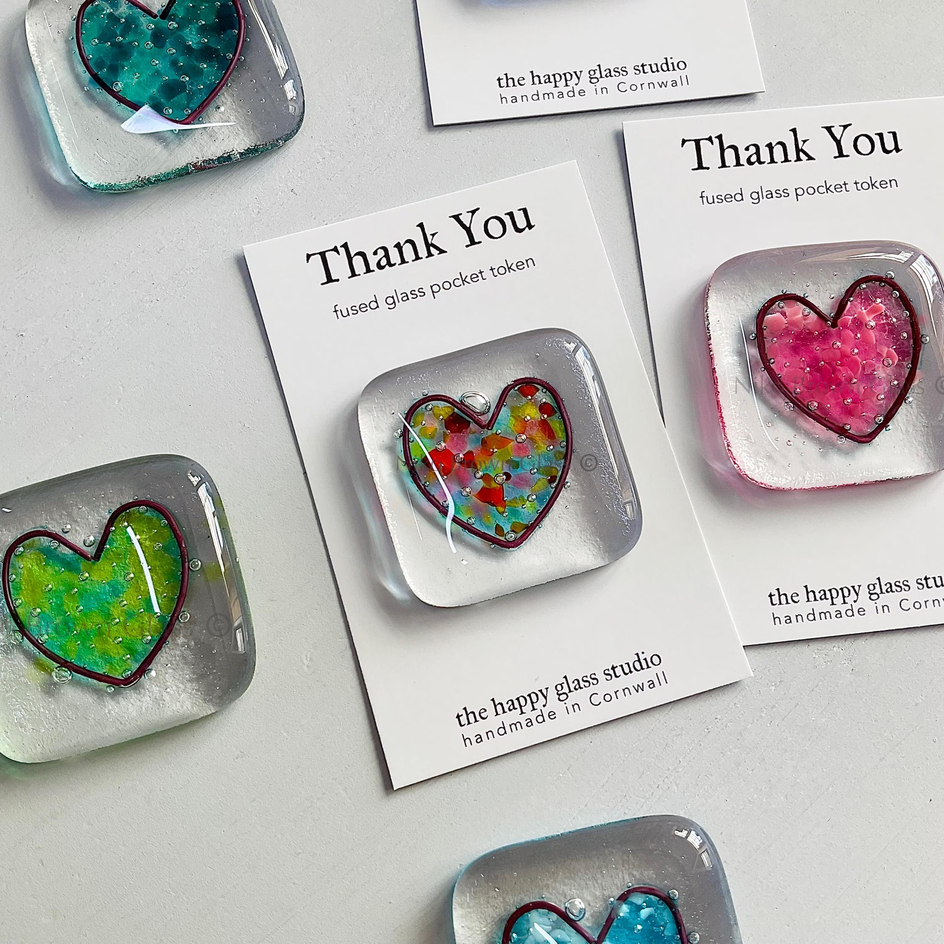 A glass pocket token with information