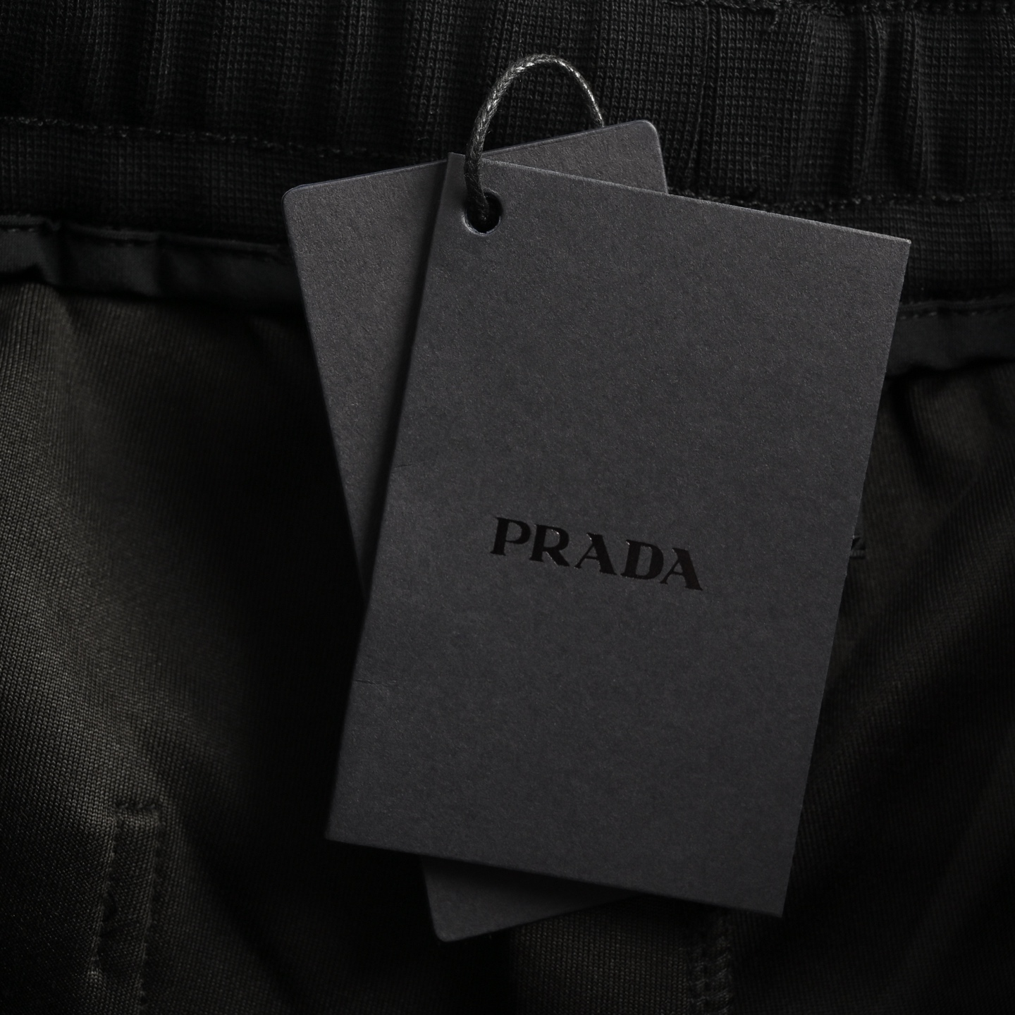 Prada 25ss triangle hem nylon patchwork pocket shorts