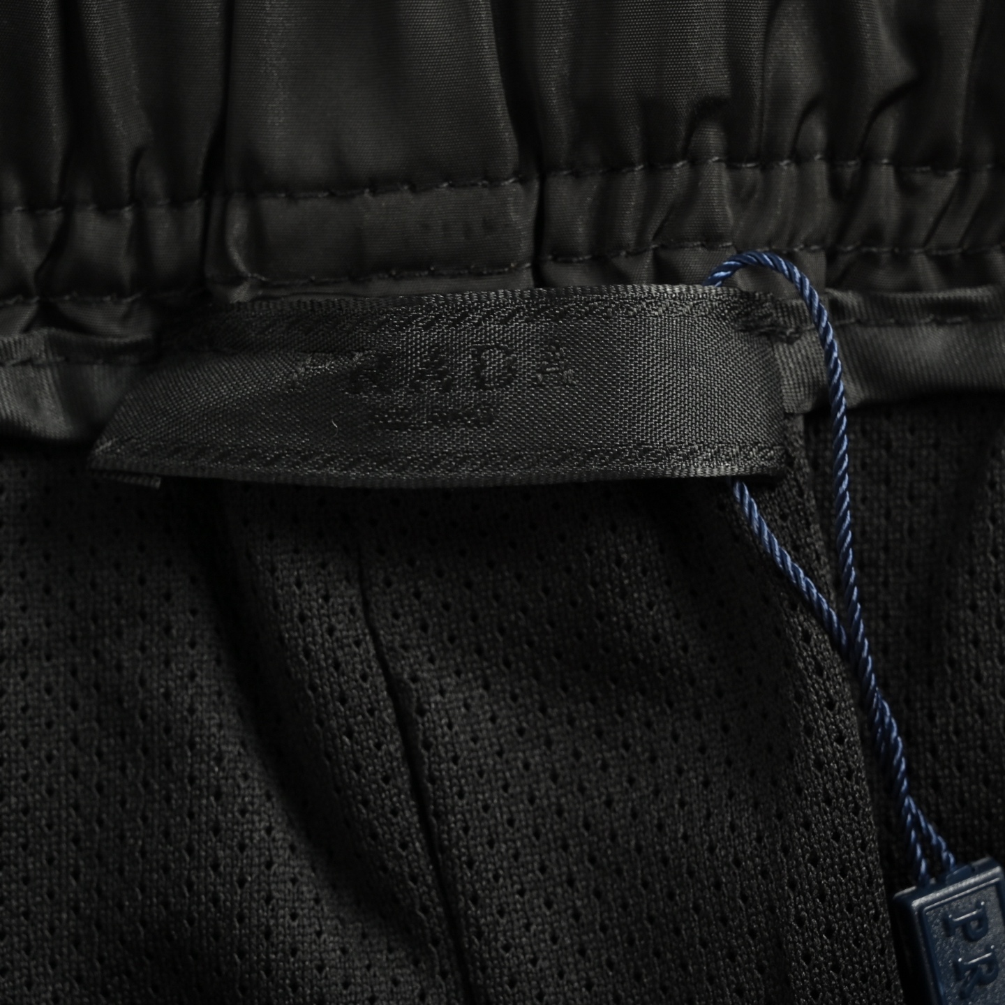 Prada 25ss triangle logo zip pocket nylon shorts