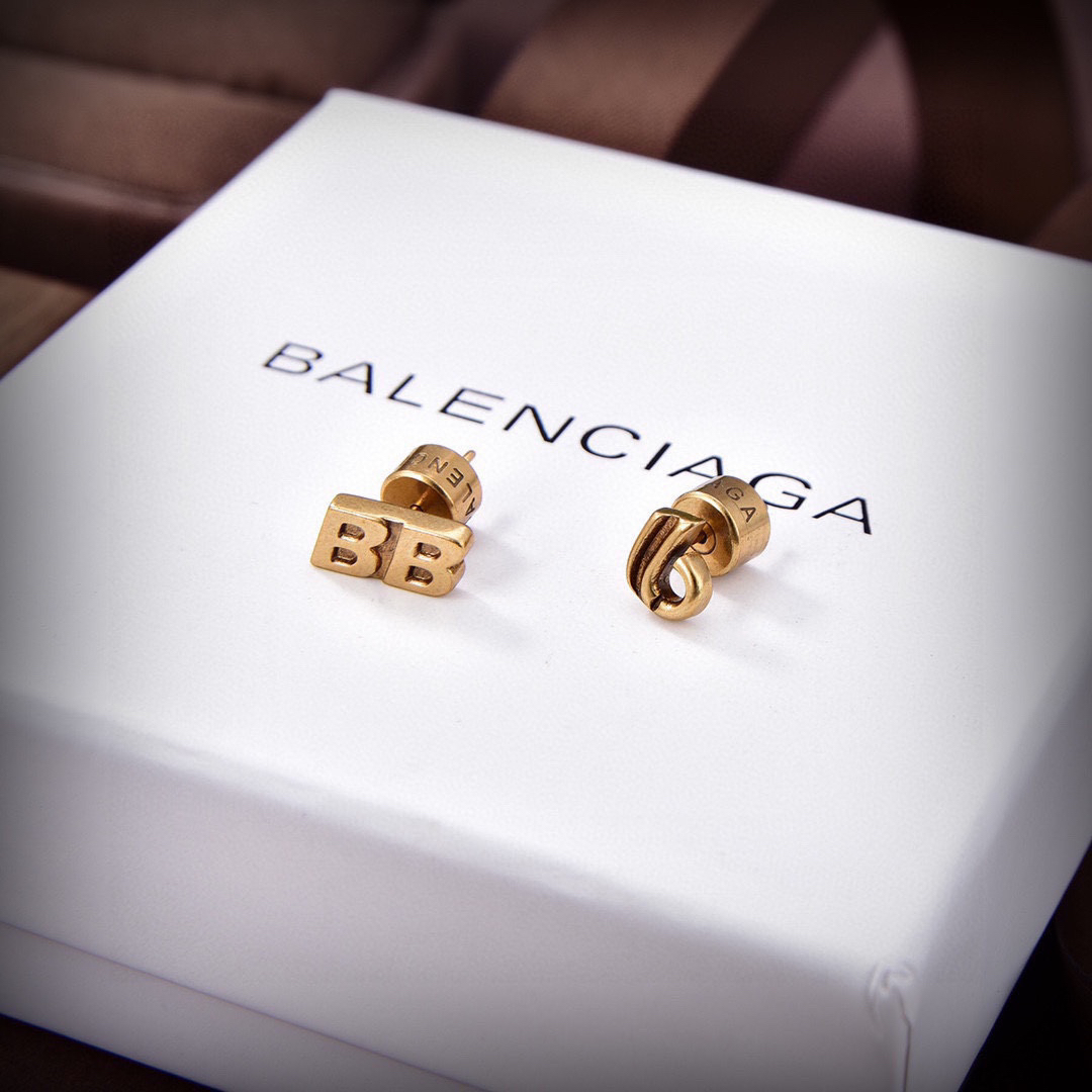 Balenciaga distressed letter earrings