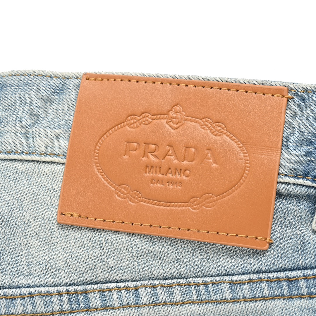 Prada washed jeans with embossed logo on back pocket
