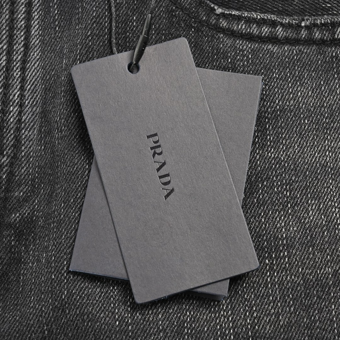 Prada 23Fw washed jeans with triangle logo embroidery