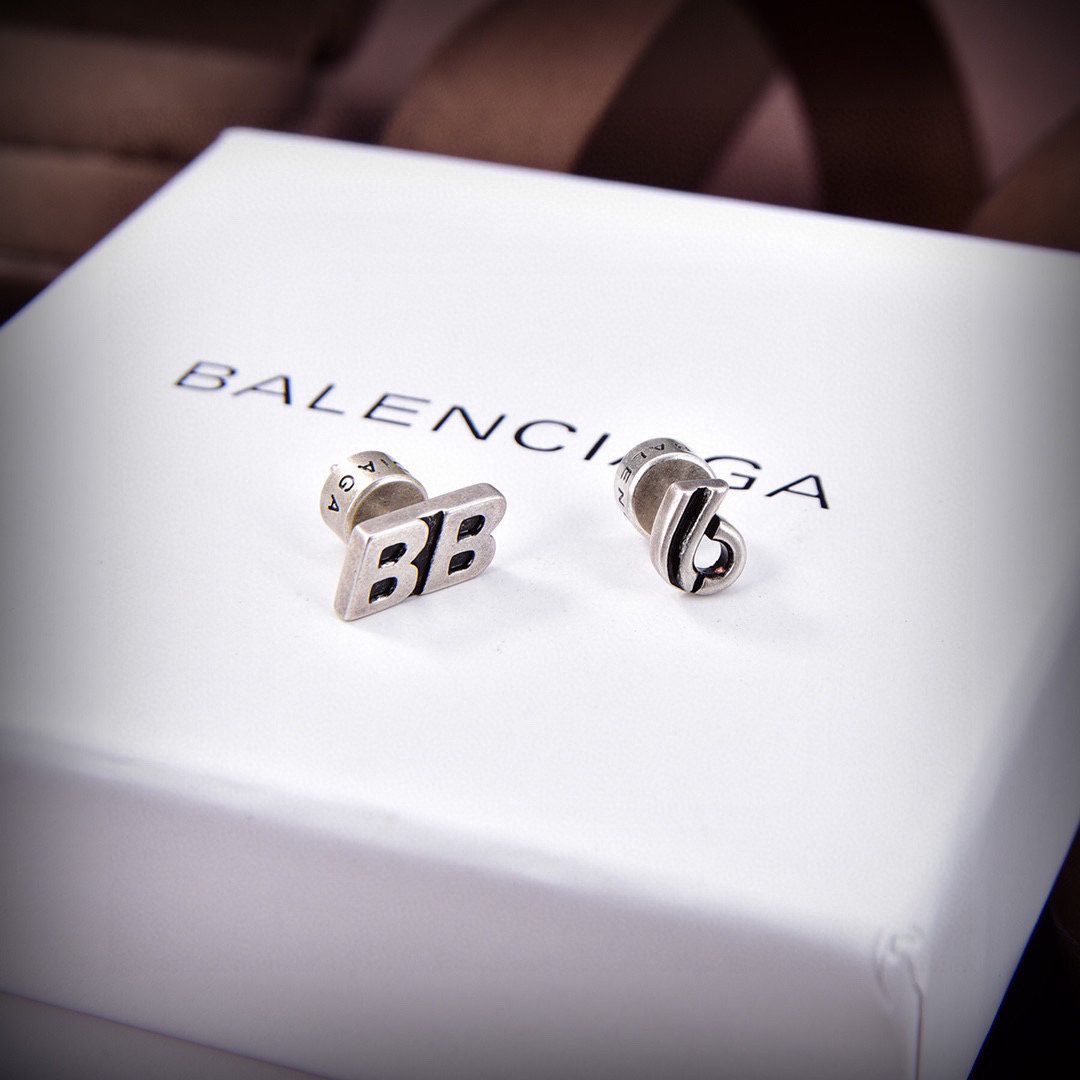 Balenciaga distressed letter earrings