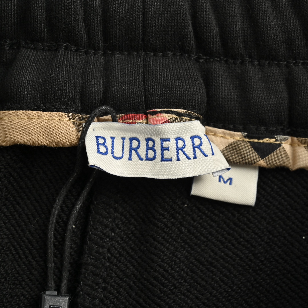 Burberry side-embossed logo check trousers