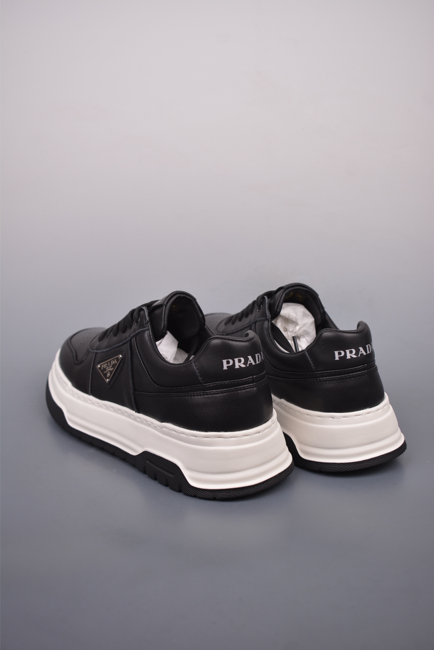 Prada PRAX 01 Triangle Logo Leather Sneakers Black and White D933M_3LF5_FG000