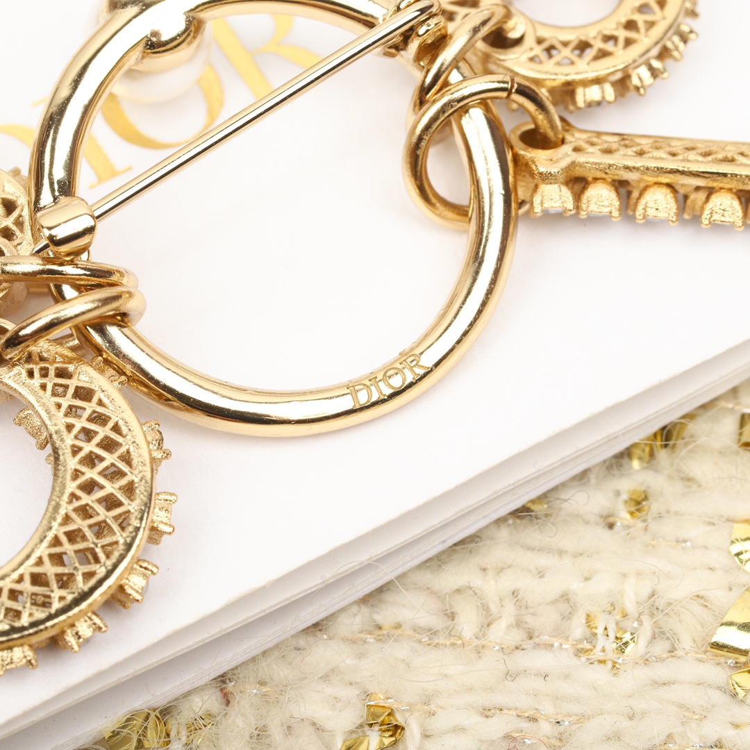 Dior diamond letter brooch