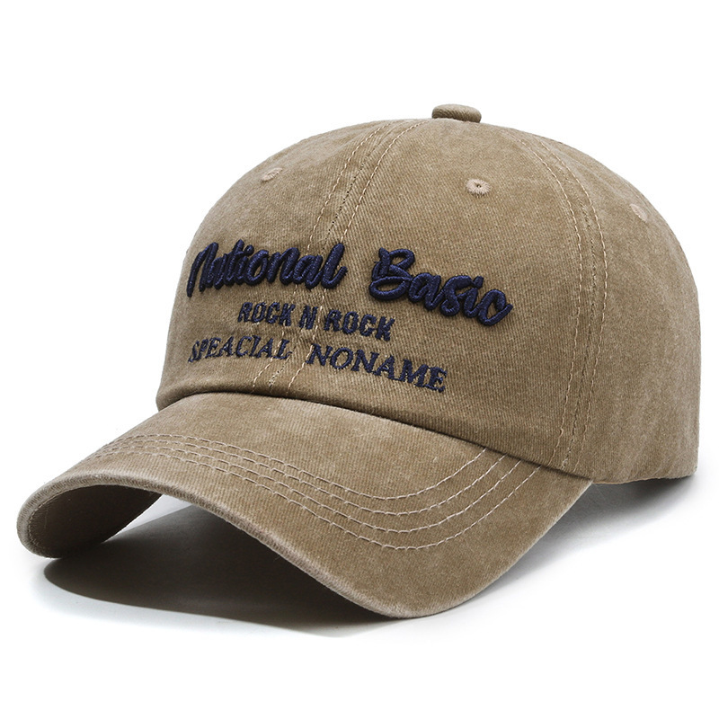 Fashionable washed denim baseball cap with wide brim, a curved visor, and sun protection.