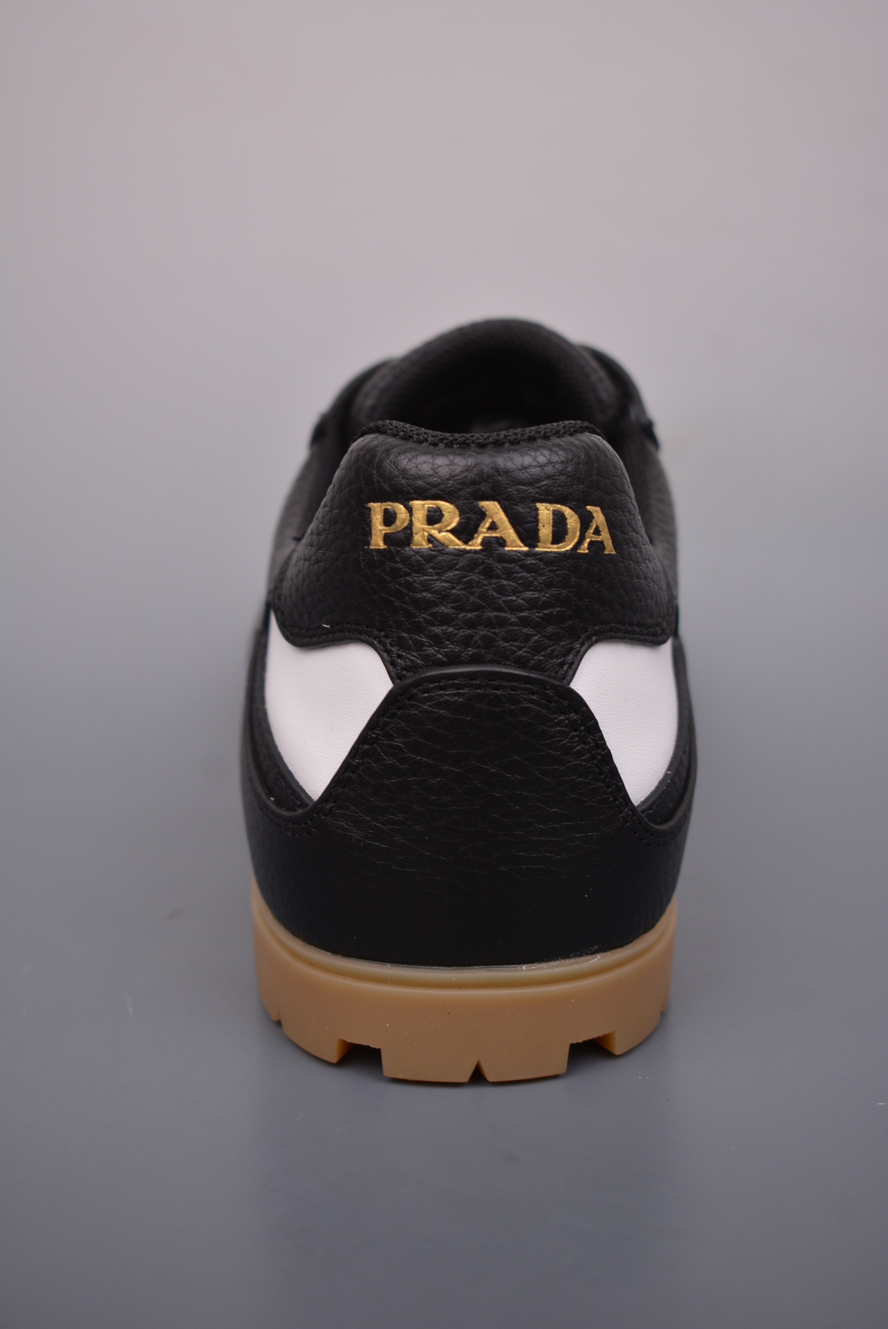 Prada Downtown Low Sneakers in black and white pebbled leather