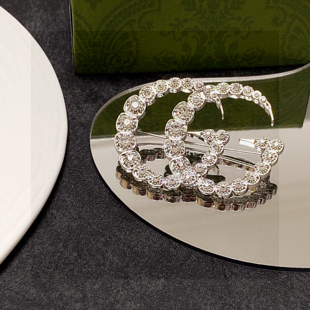 Gucci GG diamond brooch