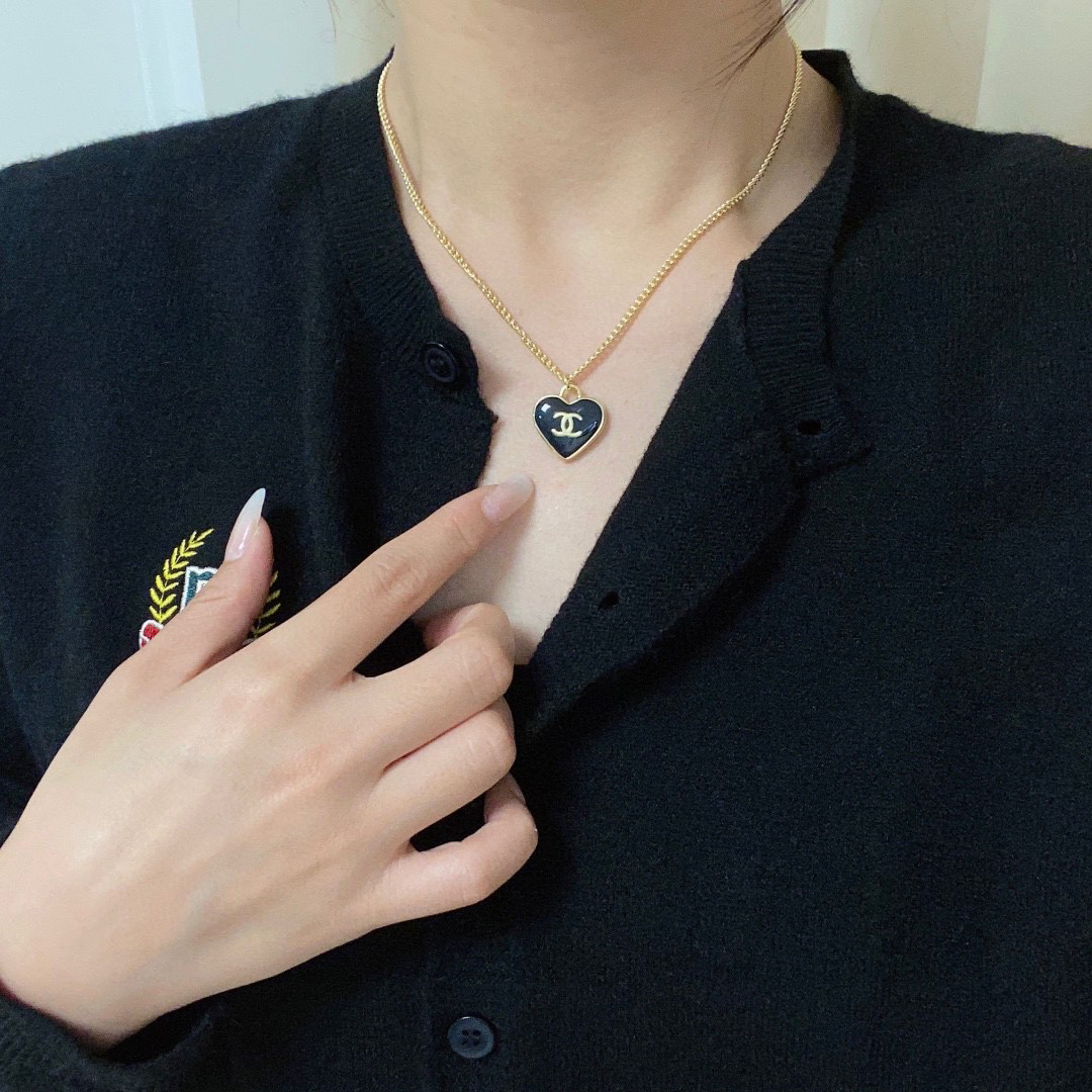 Chanel black heart double-sided necklace