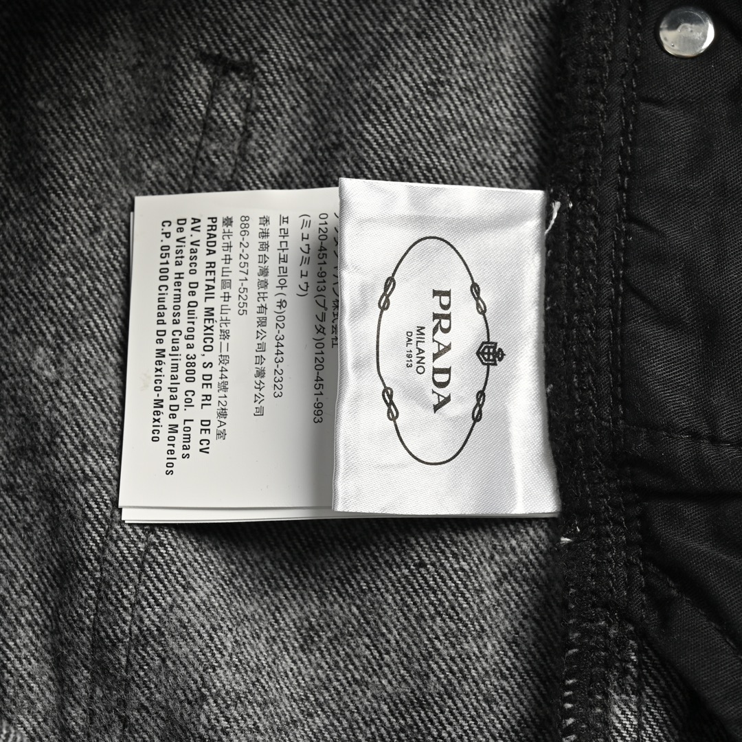 Prada 23Fw triangle logo embossed washed denim