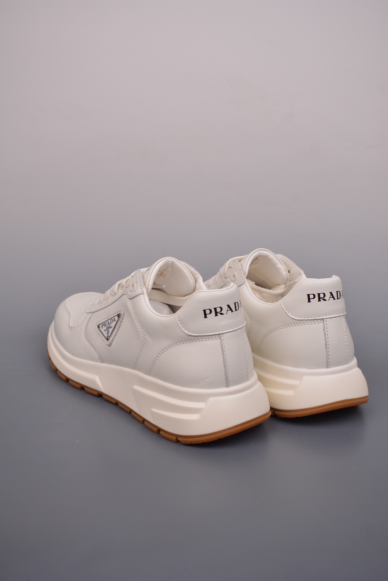 Prada PRAX 01 Triangle Logo Leather Sneakers off-white 3D936M_3LF5_FG000