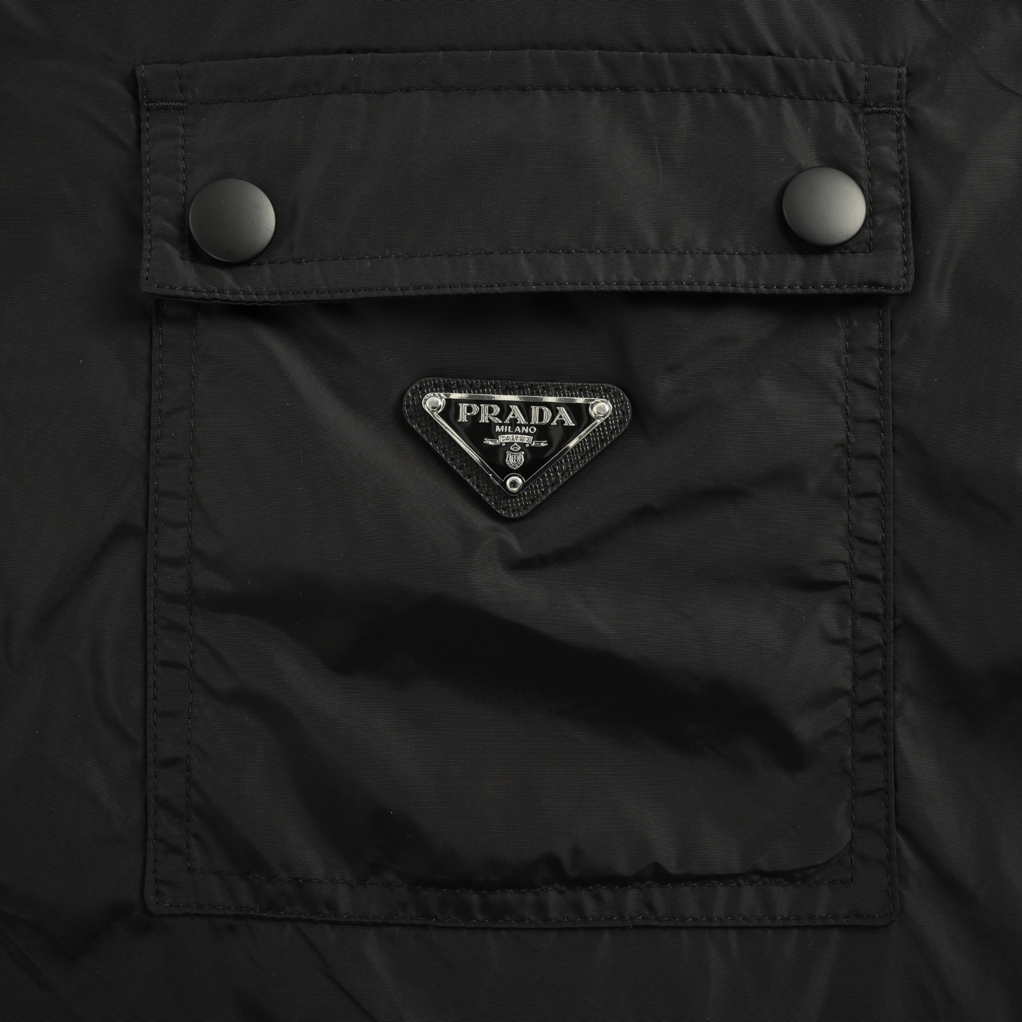 Prada 25Fw recycled nylon trousers with back flap pockets