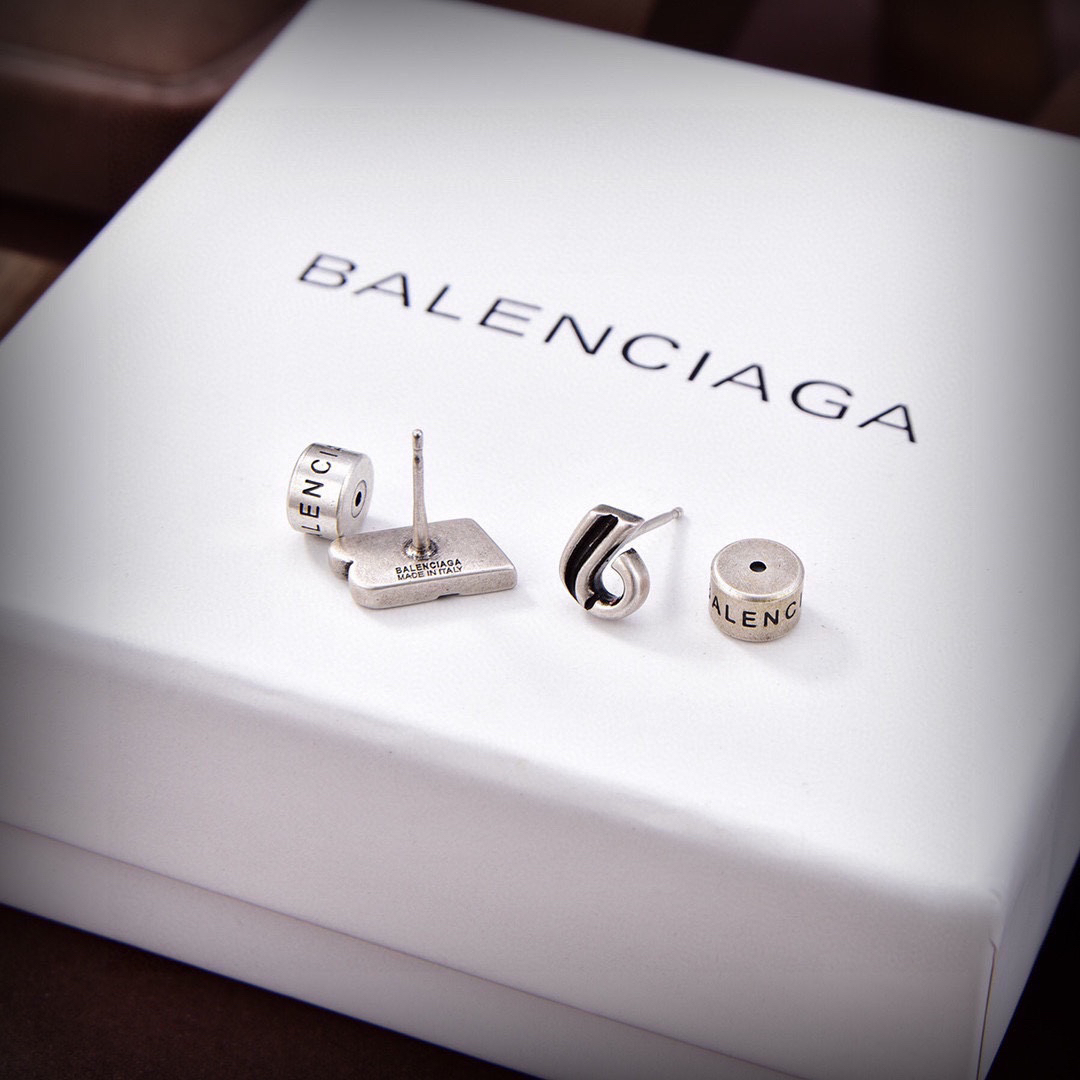 Balenciaga distressed letter earrings