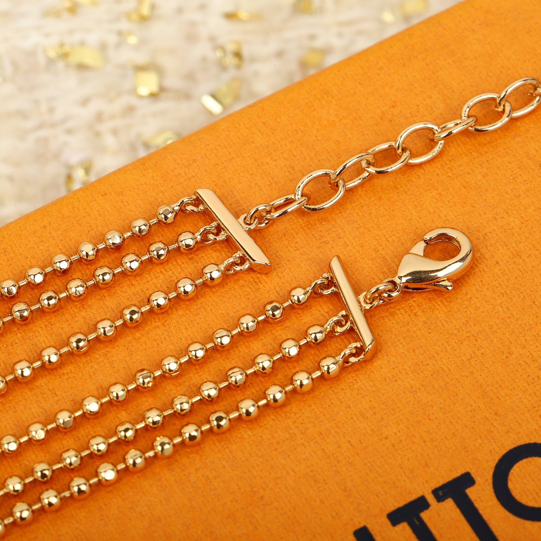 Louis Vuitton triple bead necklace