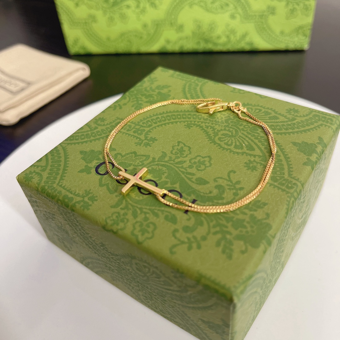 Gucci gold-tone cross bracelet