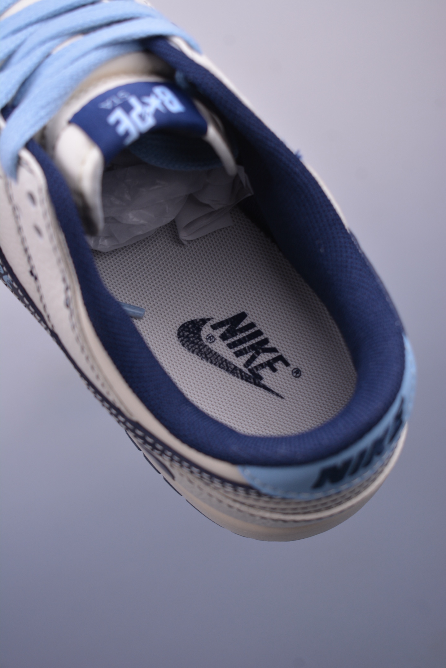 BAPE x Nike SB Dunk Low Low-top Sneakers Off-White and Black BZ2501-100