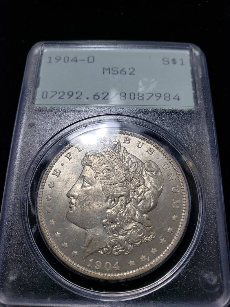 1904 O  Morgan Silver Dollar PCGS MS62, Old Green Rattler.   Lot # 1490 Regular 115