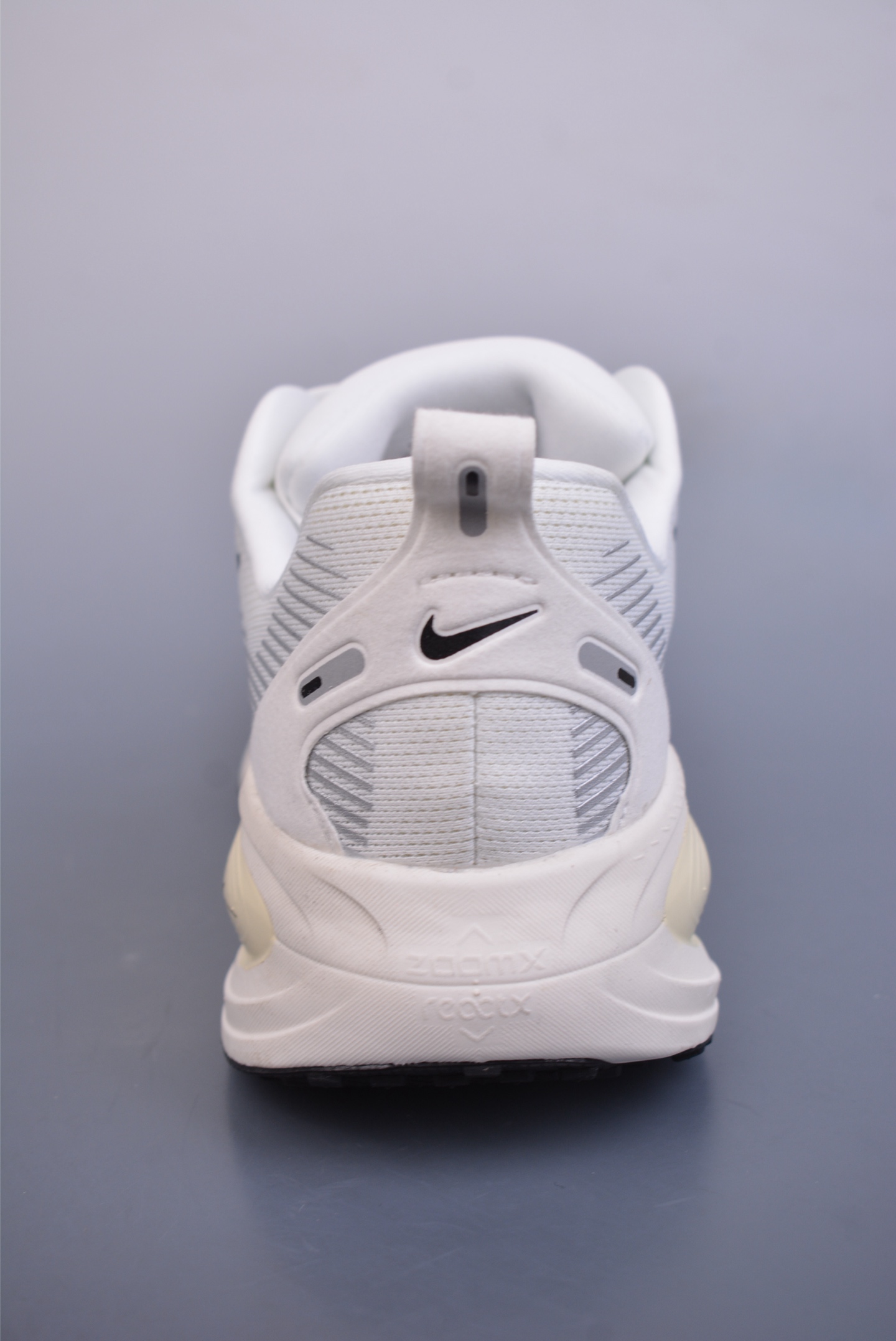Nike Vomero 18 ZoomX running shoes off-white and black hook HM6803-101