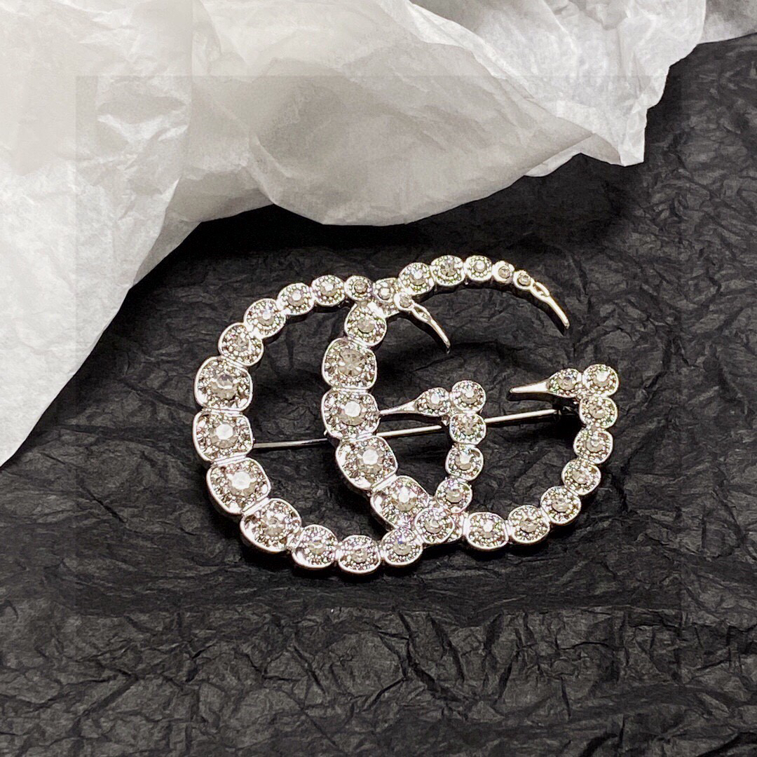 Gucci GG diamond brooch