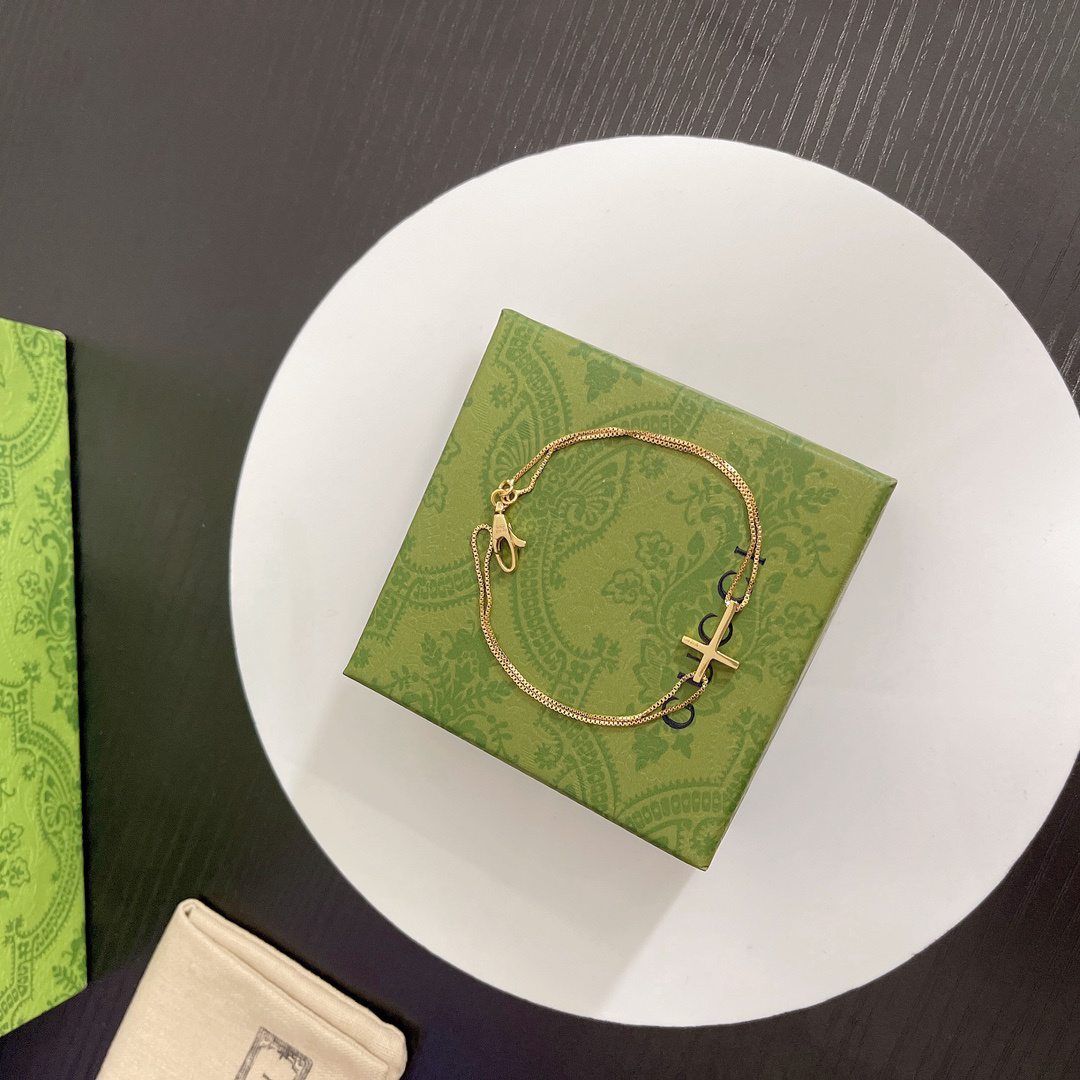 Gucci gold-tone cross bracelet