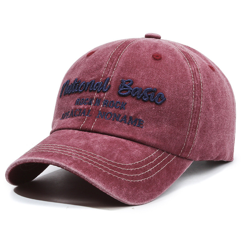 Fashionable washed denim baseball cap with wide brim, a curved visor, and sun protection.