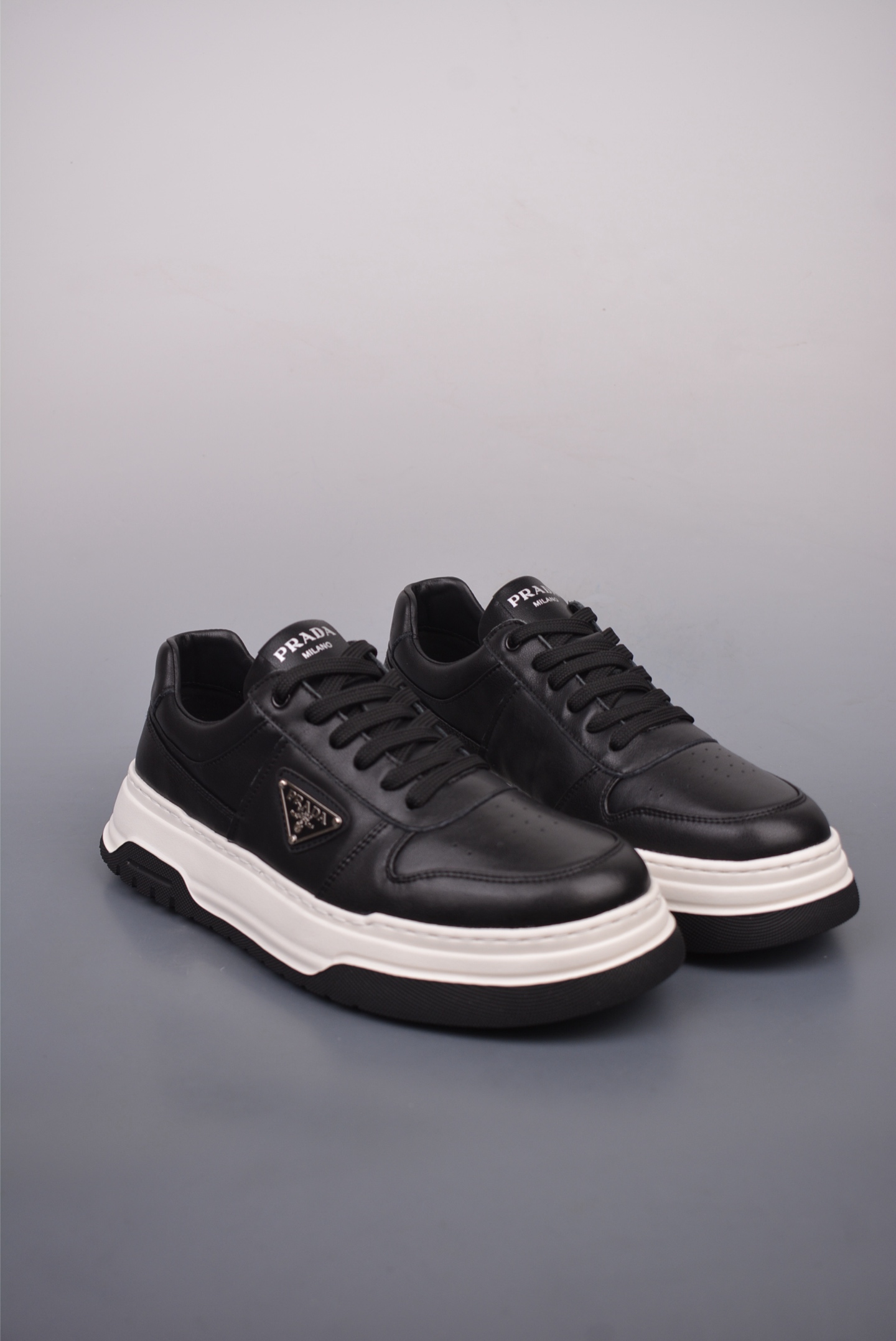 Prada PRAX 01 Triangle Logo Leather Sneakers Black and White D933M_3LF5_FG000