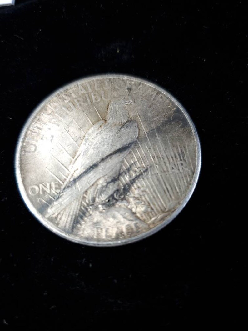1925  Silver Peace Dollar AU - tarnish on obverse/reverse   Lot# 129