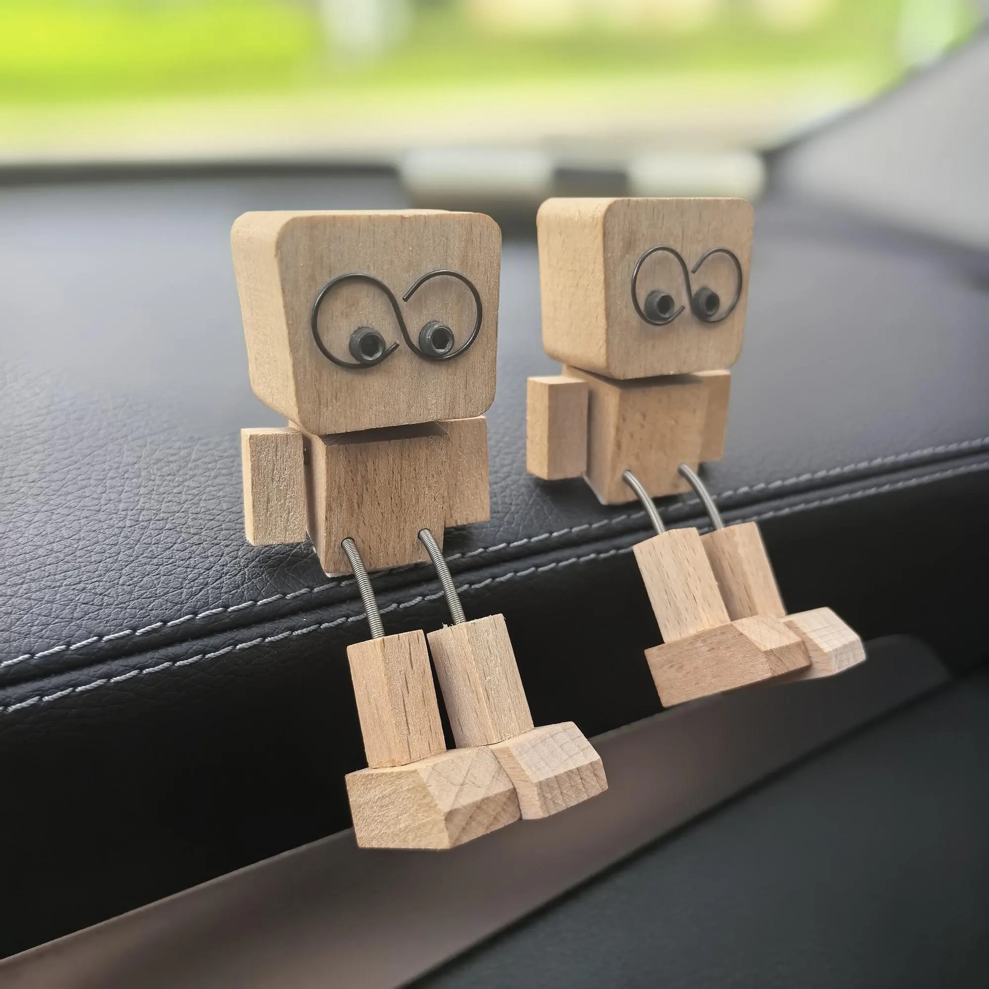 Wooden figurine with leg shaking