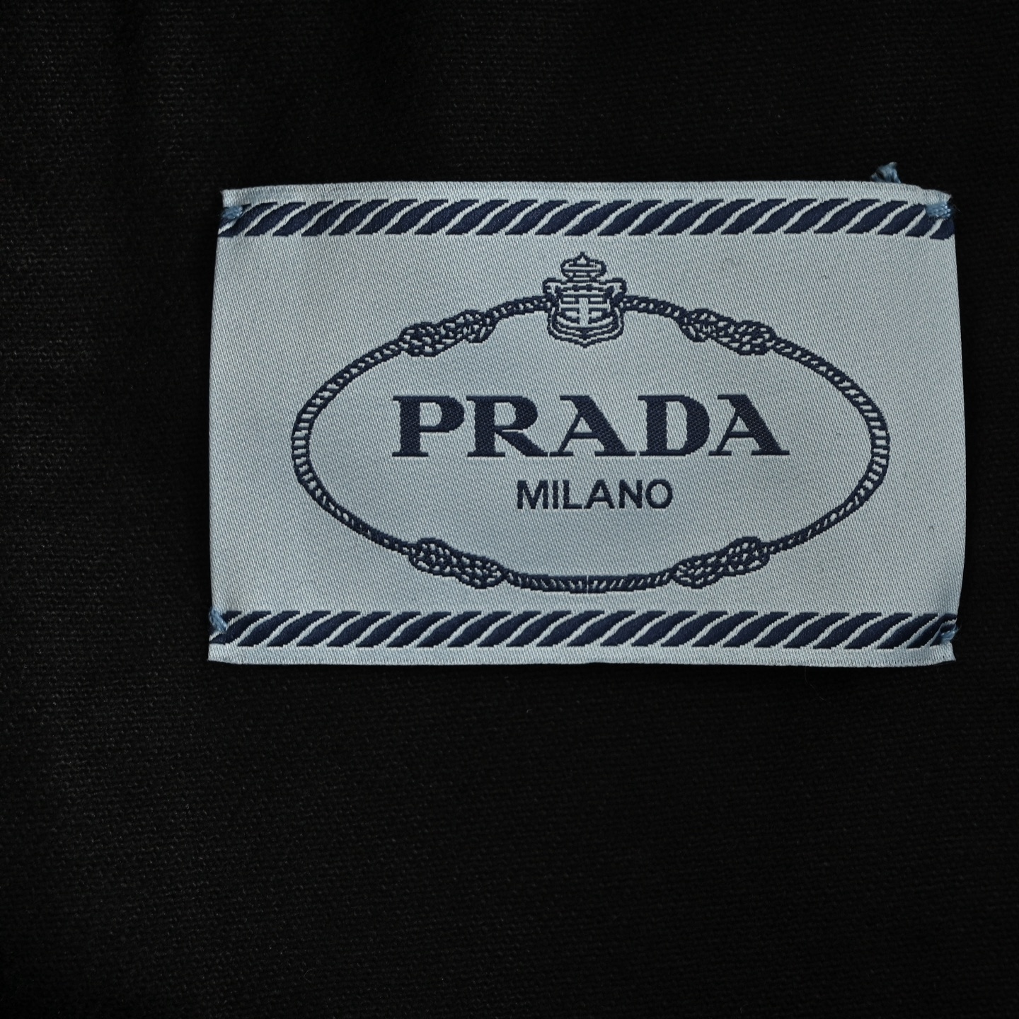 Prada 25ss denim jacket with triangle logo on the hem