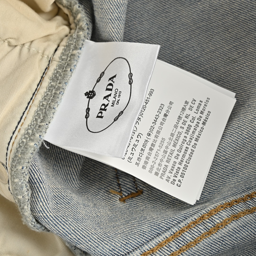 Prada washed jeans with embossed logo on back pocket