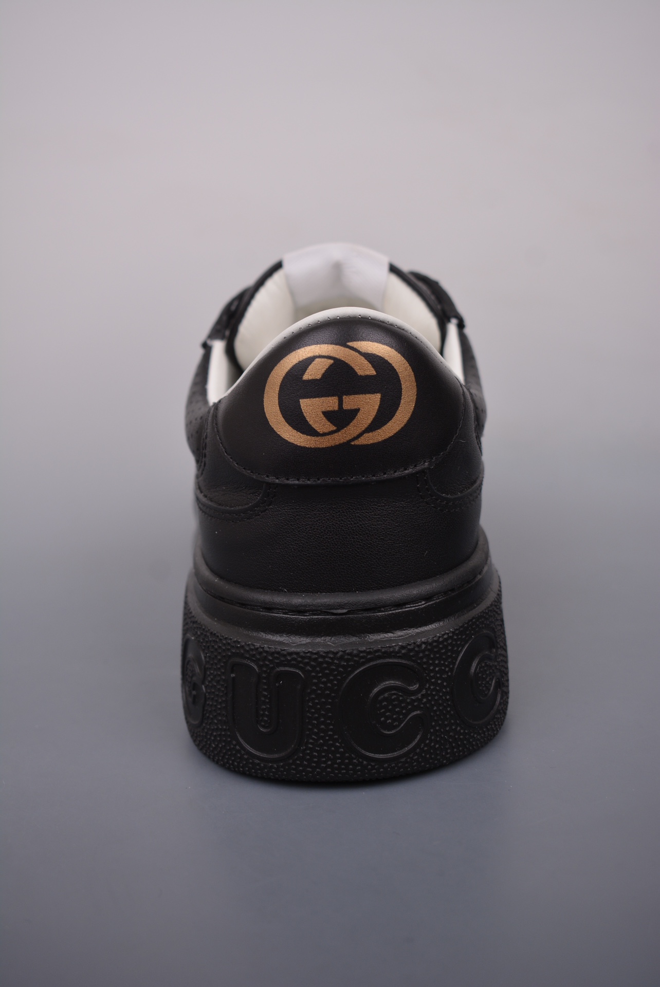 GUCCI punched leather all black gold GG print embossed