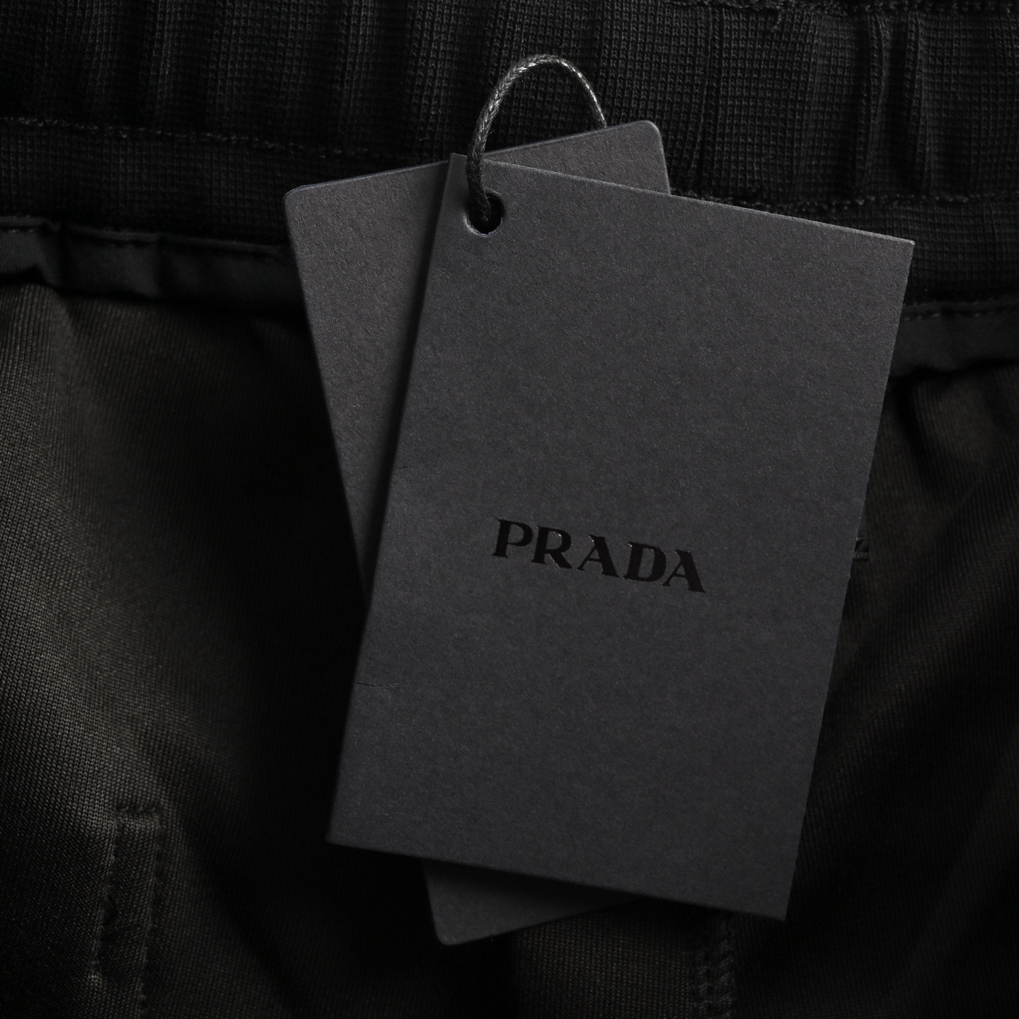 Prada 25ss triangle hem nylon patchwork pocket shorts
