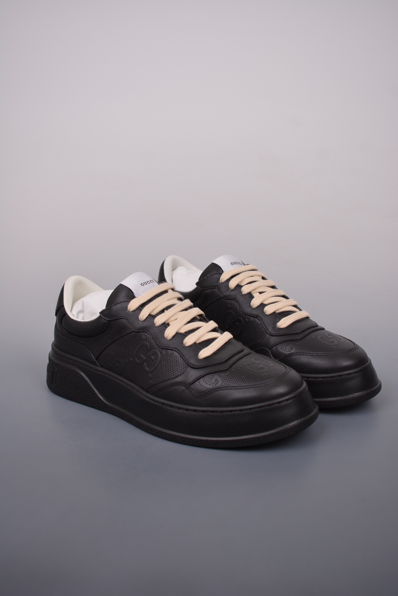 GUCCI punched leather all black gold GG print embossed