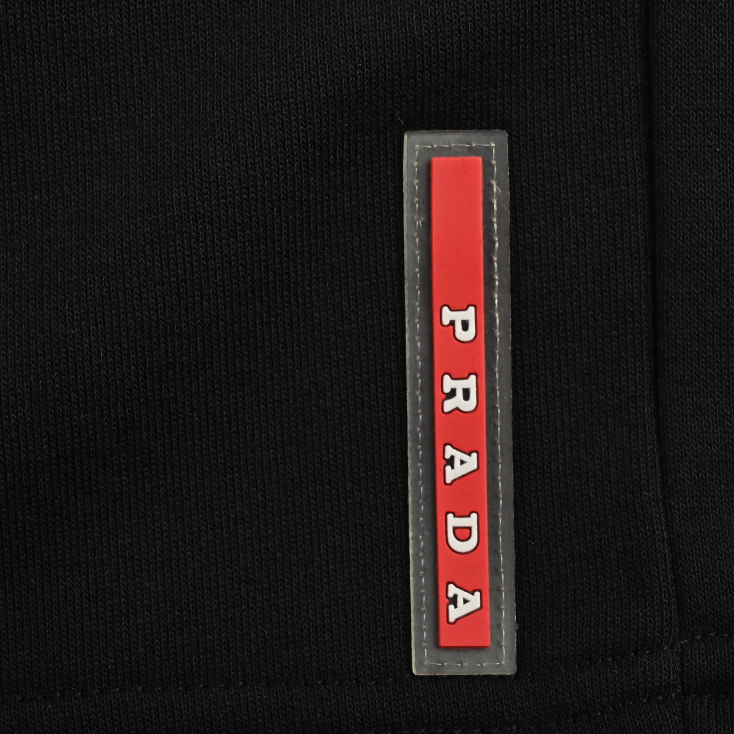Prada triangle logo red rubber shorts